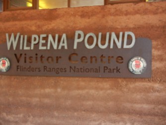SIgn saying "Wilpena Pound Visitor Centre, Flinders Ranges National Park"