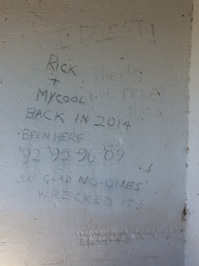 Graffitti reading: "Rick and Mycool back in 2014 Been here '92 '95 '96 '09 so glad no-one's wrecked it" in block capitals