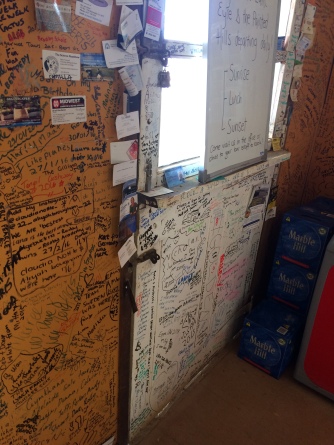 And a view of the walls - more names near a window and white board advertising fight times over Lake Eyre